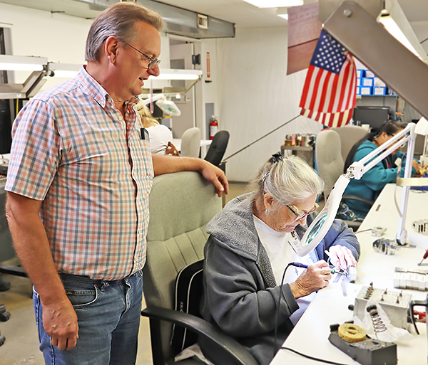 Mac Forest overseeing load cell wiring in Cardinal Scale's Load Cell Department